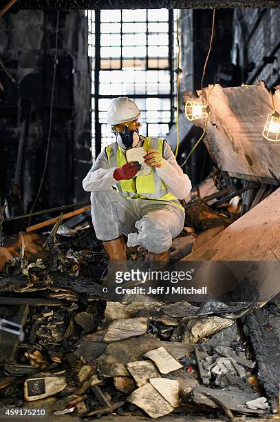 Forensic archaeologists Edward Rayner begins sifting through the ashes of the fire damaged Mackintosh Library at the Glasgow School of Art on...