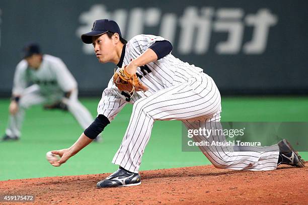 Kazuhisa Makita of Samurai Japan pitches in the eighth inning during the game five of Samurai Japan and MLB All Stars at Sapporo Dome on November 18,...