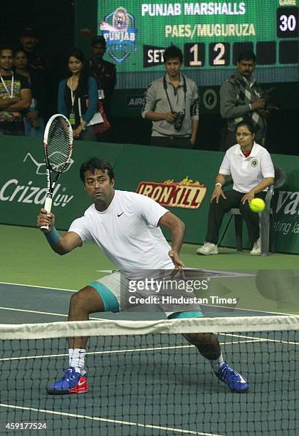 Punjab Marshalls player Leander Paes in action against Delhi Dreams players Jelena Jankovic and Kevin Anderson during mixed doubles at Champions...