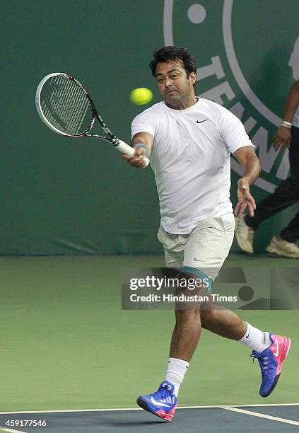 Punjab Marshalls player Leander Paes in action against Delhi Dreams players Jelena Jankovic and Kevin Anderson during mixed doubles at Champions...