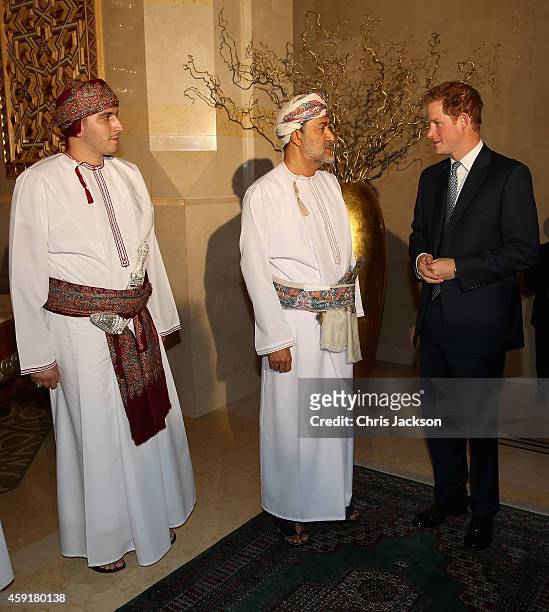 Prince Harry chats to the Sultan of Oman's First Cousin His Highness Sayyid Haithem Bin Tariq Al Said as he arrives for a private dinner at the Al...