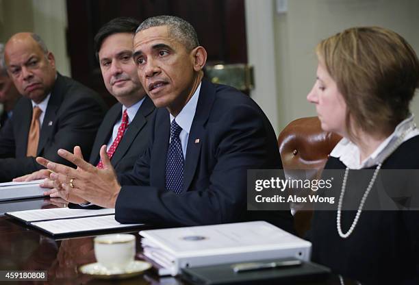 President Barack Obama speaks as Secretary of Homeland Security Jeh Johnson , White House Ebola Czar Ron Klain and White House Homeland Security...