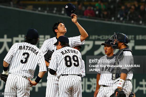 Shohei Otani and Samurai Japan gather at the mound with pitching coach during the game five of Samurai Japan and MLB All Stars at Sapporo Dome on...