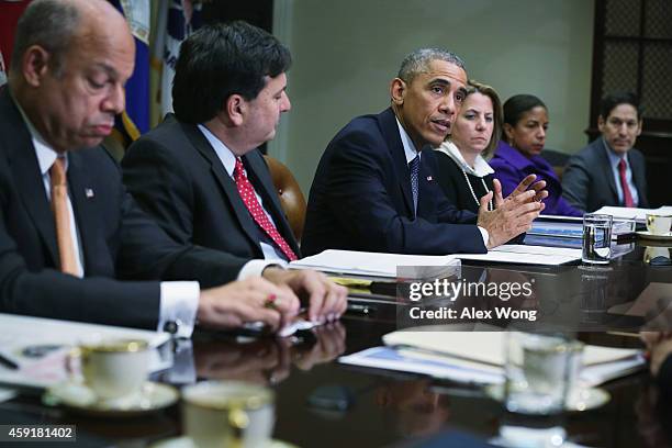 President Barack Obama speaks as Secretary of Homeland Security Jeh Johnson, White House Ebola Czar Ron Klain, White House Homeland Security Adviser...