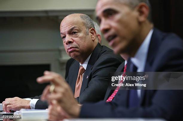 President Barack Obama speaks as Secretary of Homeland Security Jeh Johnson listens during a meeting with his national security and public health...