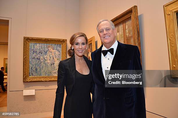 David Koch, executive vice president of Koch Industries Inc., right, and his wife Julia Koch attend a gala at the Metropolitan Museum of Art in New...