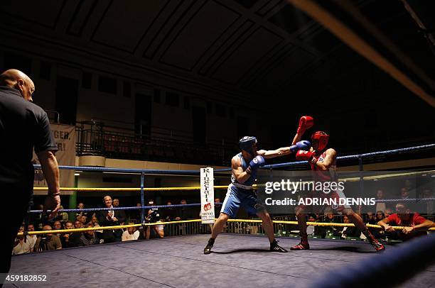 Telecoms Director Frank "The Tank" O'Callaghan lands a punch during his fight in the "Brawl at the Hall" white-collar boxing event at York Hall in...