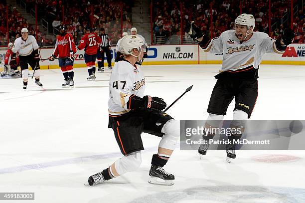Hampus Lindholm of the Anaheim Ducks celebrates with Mark Fistric after scoring the game-winning goal in the third period during an NHL game against...