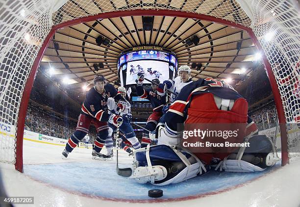 The puck gets behind Cam Talbot of the New York Rangers but doesn't enter the net during the third period against the Toronto Maple Leafs at Madison...