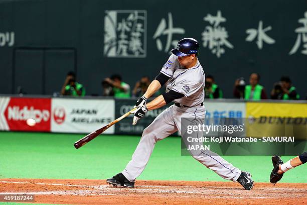 Justin Morneau of the Colorado Rockies hits a double in the nineth inningduring the game five of Samurai Japan and MLB All Stars at Sapporo Dome on...