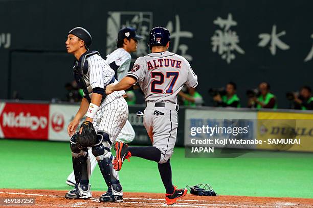 Jose Altuve celebrates on his way to scoring in the top half of the sixth inning during the game five of Samurai Japan and MLB All Stars at Sapporo...