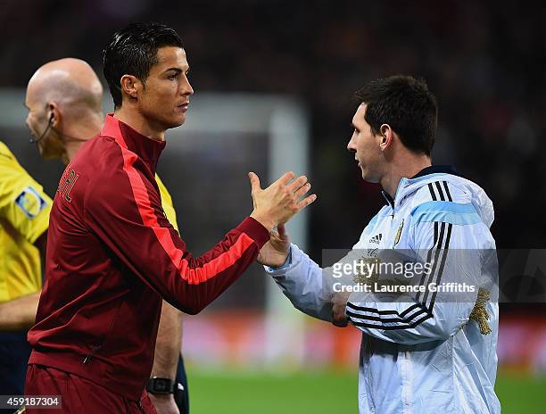 Cristiano Ronaldo of Portugal shakes hands with Lionel Messi of Argentina prior to the International Friendly between Argentina and Portugal at Old...
