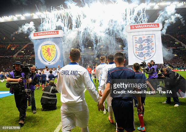 THe England team head out during the International Friendly between Scotland and England at Celtic Park Stadium on November 18, 2014 in Glasgow,...