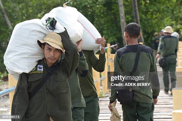 Indonesia-environment-animal-rhino,FEATURE by Arlina Arshad This picture taken on November 16, 2013 shows Indonesian rangers from the Rhino...