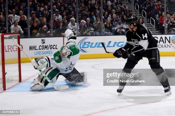 Justin Williams of the Los Angeles Kings shoots and scores a goal against Kari Lehtonen of the Dallas Stars at Staples Center on December 23, 2013 in...