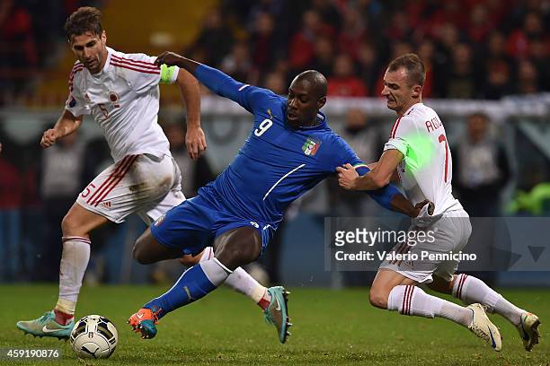 Stefano Okaka of Italy is challenged by Ansi Agolli of Albania during the International Friendly match between Italy and Albania at Luigi Ferraris on...
