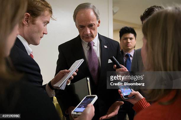 Senator Tom Carper, a Democrat from Delaware, center, talks to members of the media after a Democratic luncheon at the U.S. Capitol Building in...