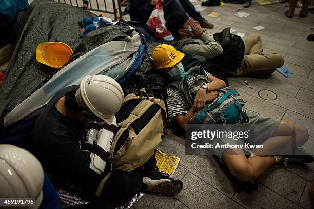 Pro-democracy protesters sleep on the floor outside the Legislative Council building after clashes with pro-democracy activists on November 19, 2014...