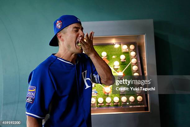 Jeremy Guthrie of the Kansas City Royals eats wasabi pop corn before the game against the Samurai Japan at the Sapporo Dome during the Japan All-Star...