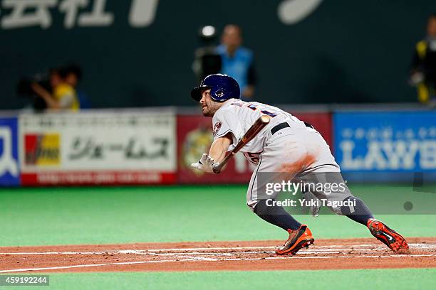 Jose Altuve of the Houston Astros hits an RBI ground out in the third inning during the game against the Samurai Japan at the Sapporo Dome during the...