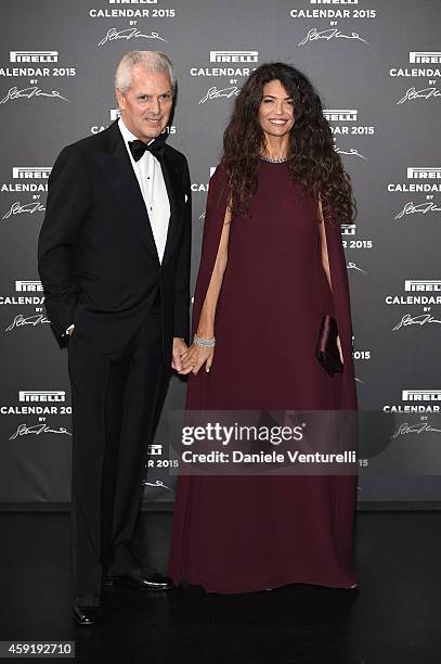 Afef Jnifen and Marco Tronchetti Provera attend the 2015 Pirelli Calendar Red Carpet on November 18, 2014 in Milan, Italy.