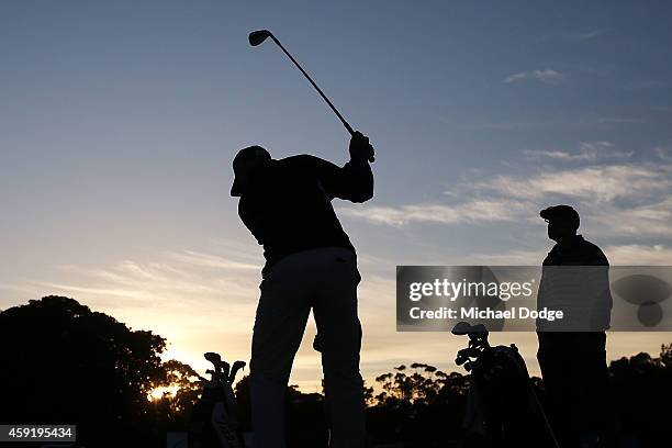 David McKenzie of Australia tees off on the practice fairway ahead of the 2014 Australian Masters at The Metropolitan Golf Course on November 19,...