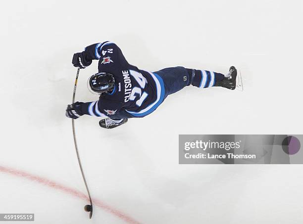 Grant Clitsome of the Winnipeg Jets gets set to take a shot during the pre-game warm up prior to NHL action against the Dallas Stars at the MTS...