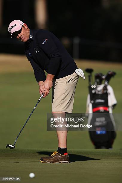 Former Australian Test cricketer Shane Warne putts the ball during the Pro-Am ahead of the 2014 Australian Masters at The Metropolitan Golf Course on...