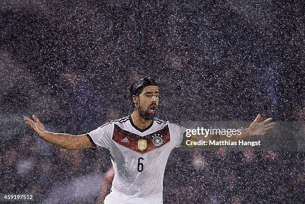 Sami Khedira of Germany reacts in the rain during the International Friendly match between Spain and Germany at Estadio Balaidos on November 18, 2014...