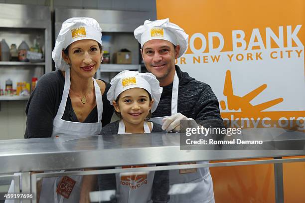 Alysia Reiner, Livia Basche and David Alan Basche attend the Food Bank For New York City's "Thankful To Give" Holiday Campaign at Food Bank for New...
