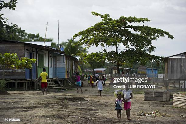 Children walk in Las Mercedes, rural area of Quibdo, Department of Choco, Colombia, on November 18 where Colombian General Ruben Alzate was...