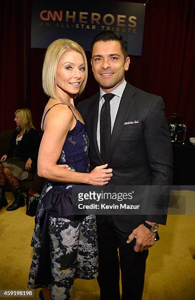 Kelly Ripa and Mark Consuelos pose backstage during the 2014 CNN Heroes: An All Star Tribute at American Museum of Natural History on November 18,...