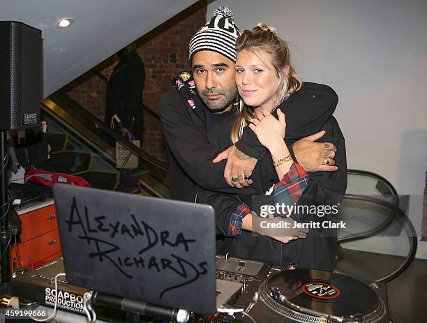 Harif Guzman and Alexandra Richards attend the Haculla Winter 2014 collection launch and live installation by Harif Guzman at Bloomingdale's Soho on...