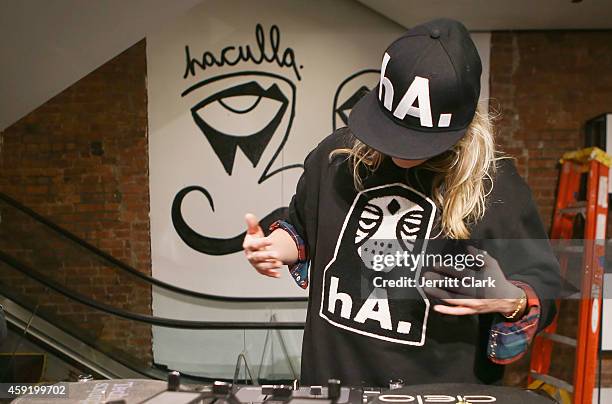 Alexandra Richards spins at the Haculla Winter 2014 collection launch and live installation by Harif Guzman at Bloomingdale's Soho on November 6,...