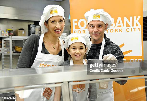 Alysia Reiner, David Alan Basche and Livia Basche attend the Food Bank For New York City's 'Thankful To Give' Holiday Campaign at Food Bank for New...