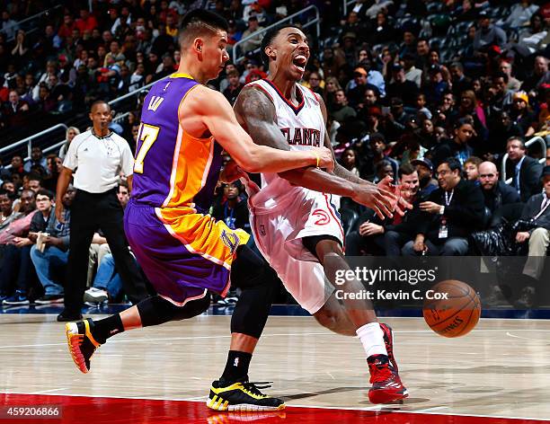 Jeremy Lin of the Los Angeles Lakers fouls Jeff Teague of the Atlanta Hawks at Philips Arena on November 18, 2014 in Atlanta, Georgia. NOTE TO USER:...