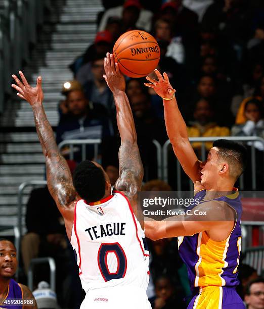 Jeff Teague of the Atlanta Hawks defends against Jeremy Lin of the Los Angeles Lakers at Philips Arena on November 18, 2014 in Atlanta, Georgia. NOTE...