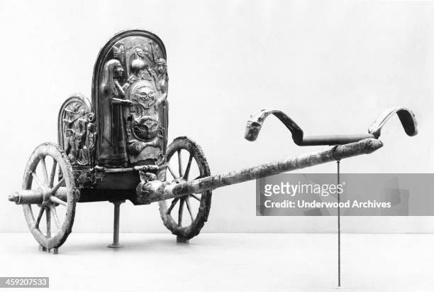 An Etruscan chariot with bronze work from 600 BC that was dug up about 50 miles from Rome, New York, New York, circa 1925. It is in the Metropolitan...
