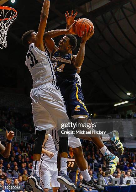 Casey Jones of the Chattanooga Mocs shoots the ball against Kameron Woods of the Butler Bulldogs at Hinkle Fieldhouse on November 18, 2014 in...