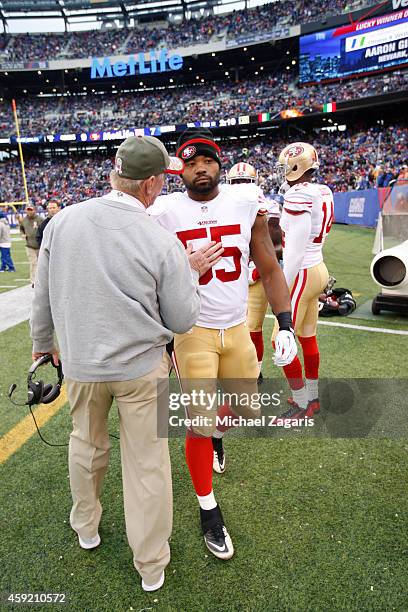 Linebackers Coach Jim Leavitt of the San Francisco 49ers talks with Ahmad Brooks during the game against the New York Giants at Metlife Stadium on...