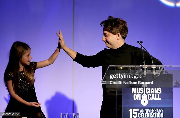 Executive Vice President Of Republic Records, Charlie Walk and his daughter onstage at Musicians On Call Celebrates Its 15th Anniversary Honoring...