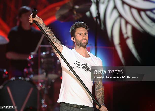 Singer Adam Levine of Maroon 5 performs onstage during A VERY GRAMMY CHRISTMAS at The Shrine Auditorium on November 18, 2014 in Los Angeles,...