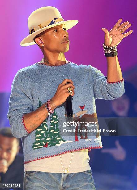 Musician Pharrell Williams performs onstage during A VERY GRAMMY CHRISTMAS at The Shrine Auditorium on November 18, 2014 in Los Angeles, California.