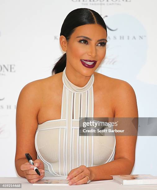 Kim Kardashian smiles as she promotes her new fragrance "Fleur Fatale" at Chadstone Shopping Centre on November 19, 2014 in Melbourne, Australia.