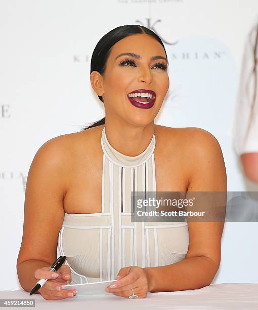 Kim Kardashian laughs as she promotes her new fragrance "Fleur Fatale" at Chadstone Shopping Centre on November 19, 2014 in Melbourne, Australia.