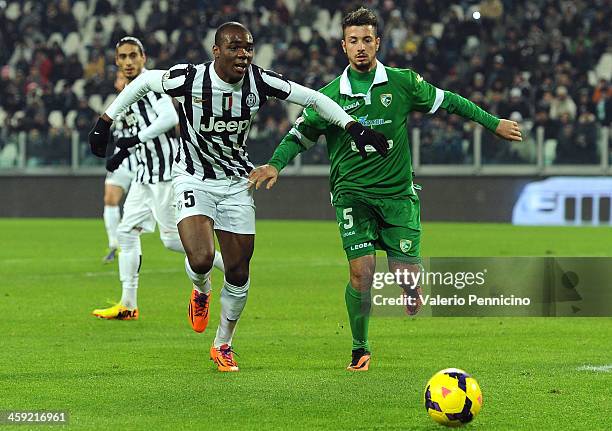 Angelo Ogbonna of Juventus competes with Armando Izzo of US Avellino during the Tim Cup match between Juventus and US Avellino at Juventus Arena on...