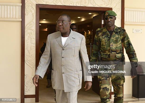 Central Africa's interim leader Michel Djotodia arrives for a press conference in Bangui on December 24, 2013. Burundian and Chadian troops in the...