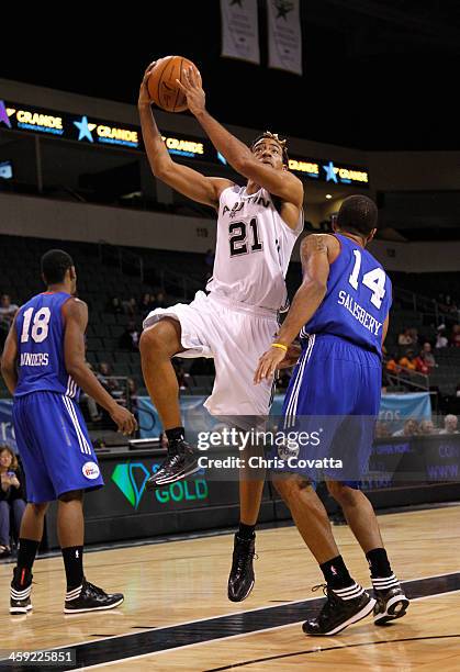 Cameron Bennerman of the Austin Toros shoots over Dustin Salisbery of the Delaware 87ers on December 20, 2013 at the Cedar Park Center in Cedar Park,...