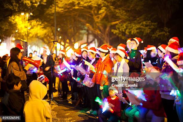 christmas carolers - carol singer stock pictures, royalty-free photos & images
