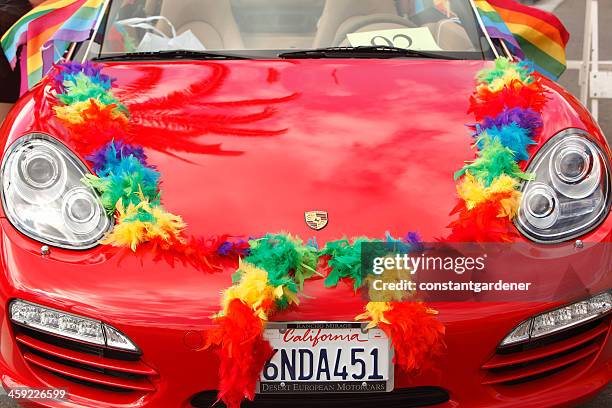 red porshe with rainbow colors in pride parade. - palm springs californie stockfoto's en -beelden